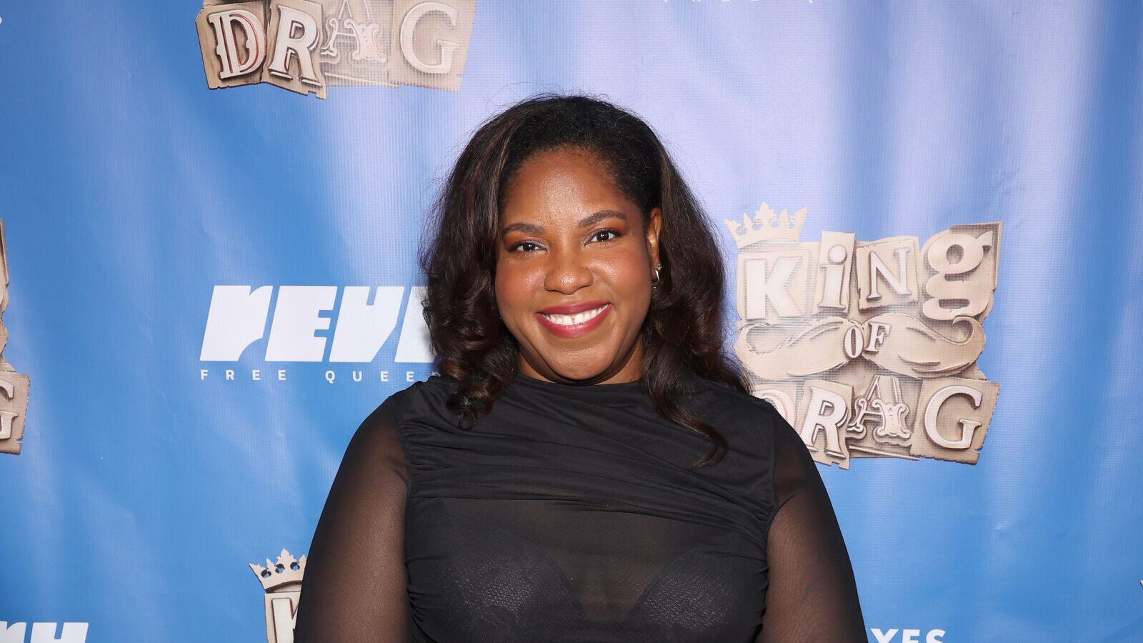 Revry co-founder Alia J. Daniels smiles at the King of Drag Season 2 premiere.