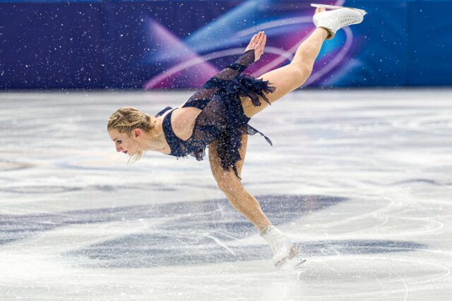 Amber Glenn of Team USA competes in the women's single skating free skating team event during the second day of the 2026 Milan-Cortina Winter Olympics at the Milan Ice Skating Arena on February 8, 2026 in Milan, Italy.