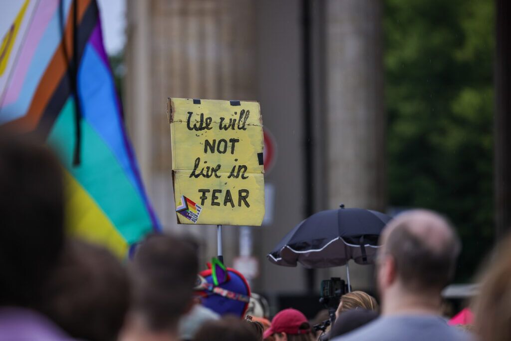 People gather at Pariser Platz in front of the Brandenburg Gate in a memorial demonstration following the alleged attack carried out last night at Tiergarten park, in which a van plowed through a crowd of revelers attending Christopher Street Day Berlin pride parade, on July 26, 2026 in Berlin, Germany. At approximately 10:00pm last night Abdul B. drove the van into a crowd in Tiergarten park, killing one woman and injuring 16. Three victims are reportedly in critical condition. (Photo by Omer Messinger/Getty Images)