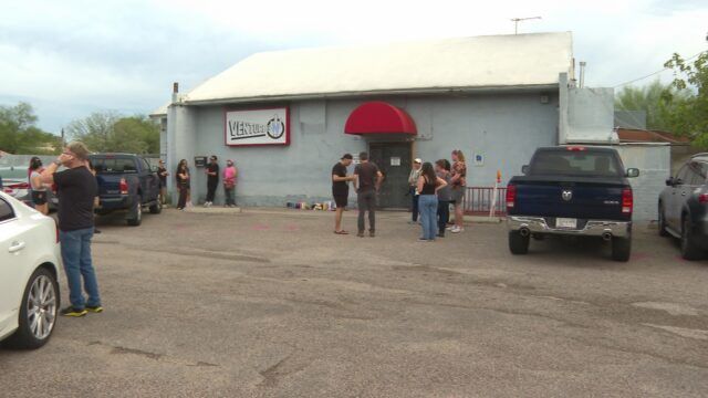 Tucson police investigate a tragic hate crime at Venture-N gay bar after two patrons were killed. The local LGBTQ+ community honors the lives lost.